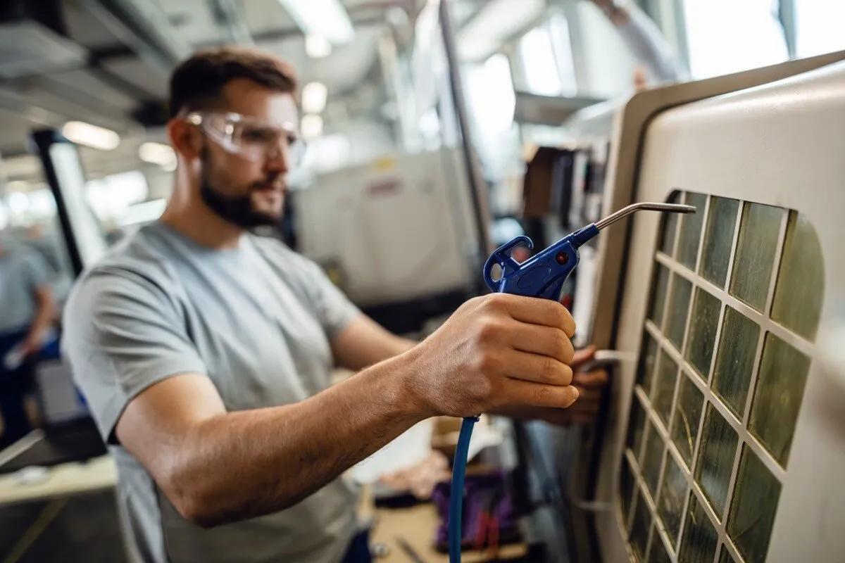 Technician servicing an AC coil